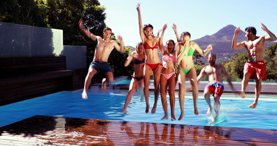 Group of Friends Jumping Into Pool During Summer Vacation - Free Images, Stock Photos and Pictures on Pikwizard.com