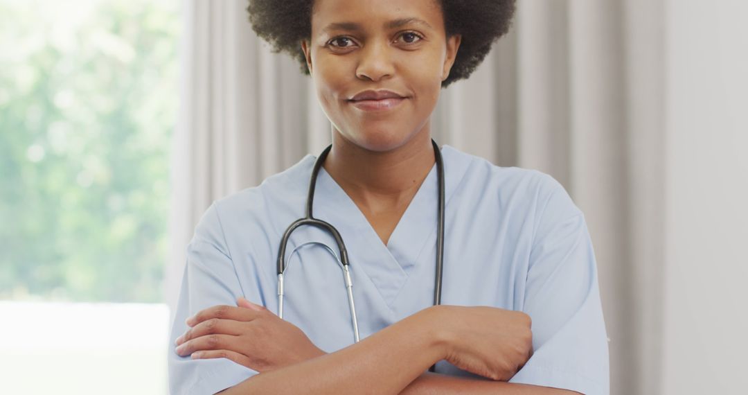 Portrait of happy african american female doctor looking at camera and smiling - Free Images, Stock Photos and Pictures on Pikwizard.com