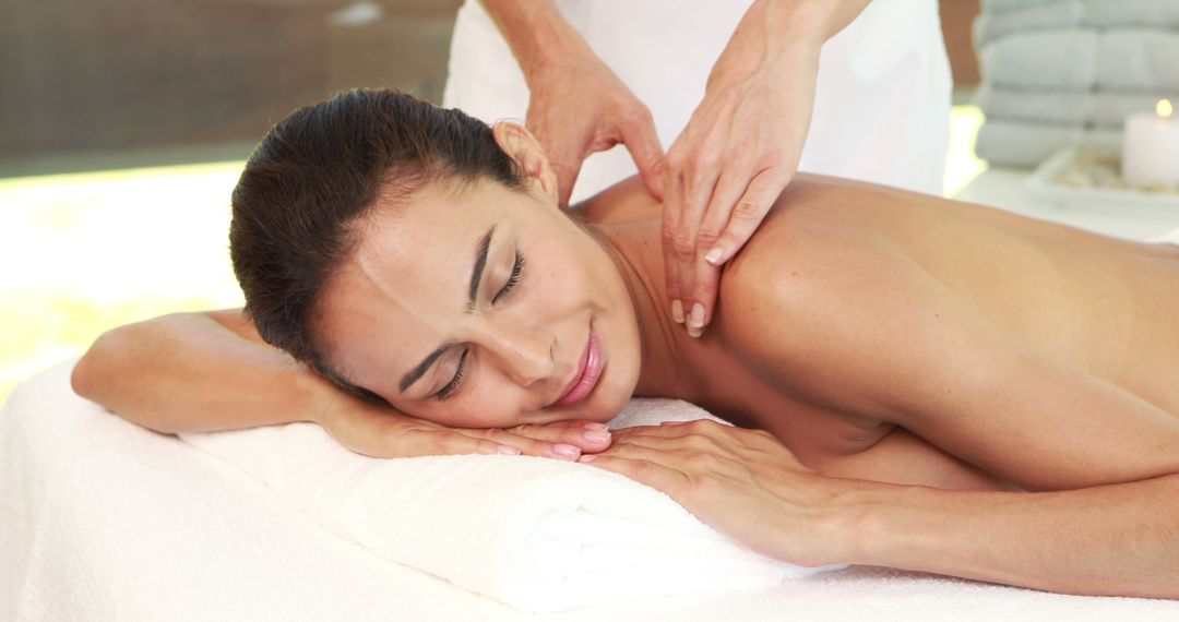 Young Woman Enjoying Relaxing SPA Massage Therapy Session - Free Images, Stock Photos and Pictures on Pikwizard.com