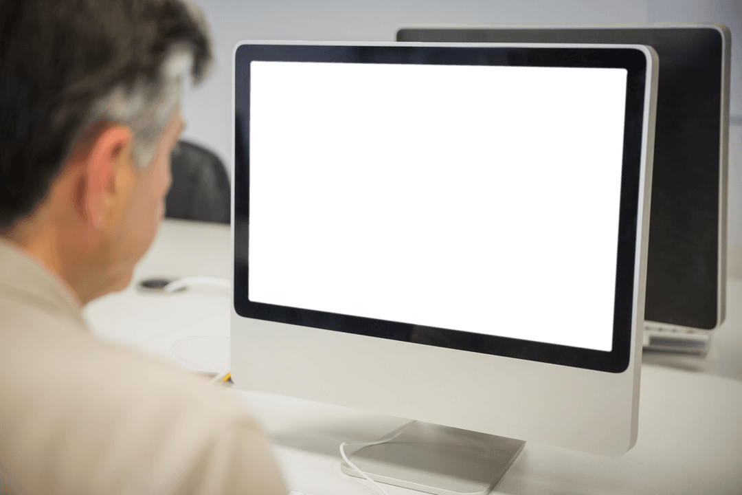 Transparent Perspective: Businessman Observing Blank Computer Monitor