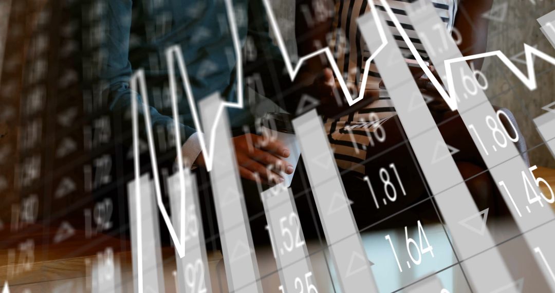 Business Teamwork with Financial Charts in Modern Office