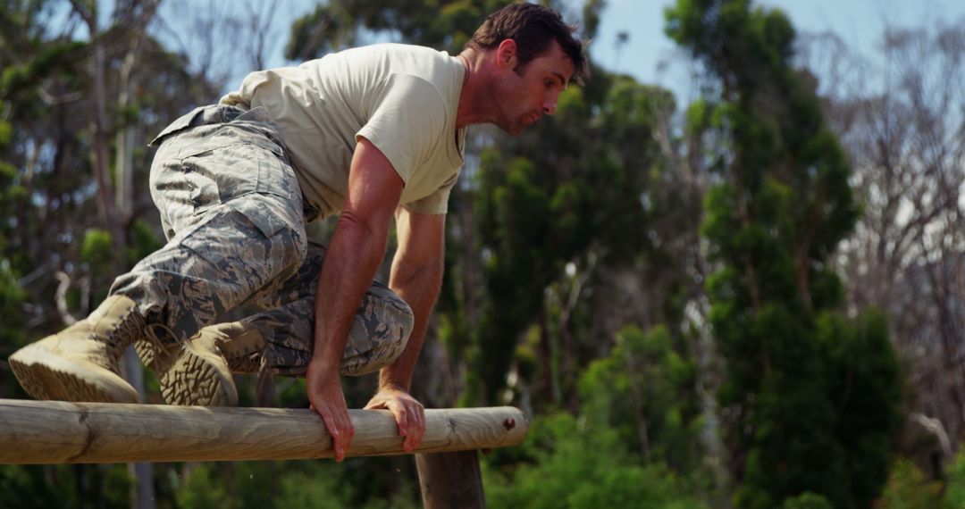 Military Man in Uniform Completes Outdoor Obstacle Course - Free Images, Stock Photos and Pictures on Pikwizard.com