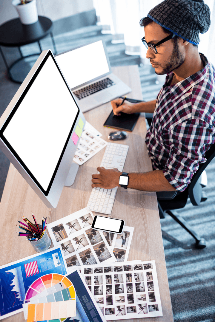 Creative Man Working on Transparent Design Projects in Office