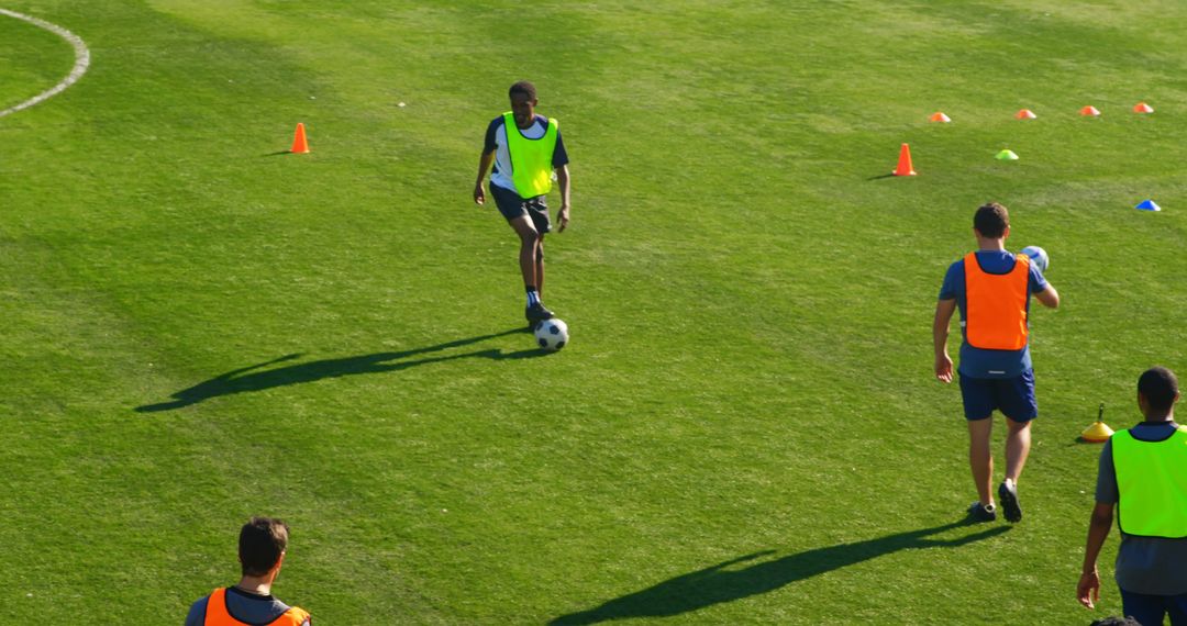 Soccer Players Training on a Grass Field with Cones - Free Images, Stock Photos and Pictures on Pikwizard.com