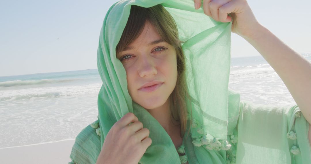 Young Woman in Green Headscarf on Tropical Beach Standing in Sunshine - Free Images, Stock Photos and Pictures on Pikwizard.com