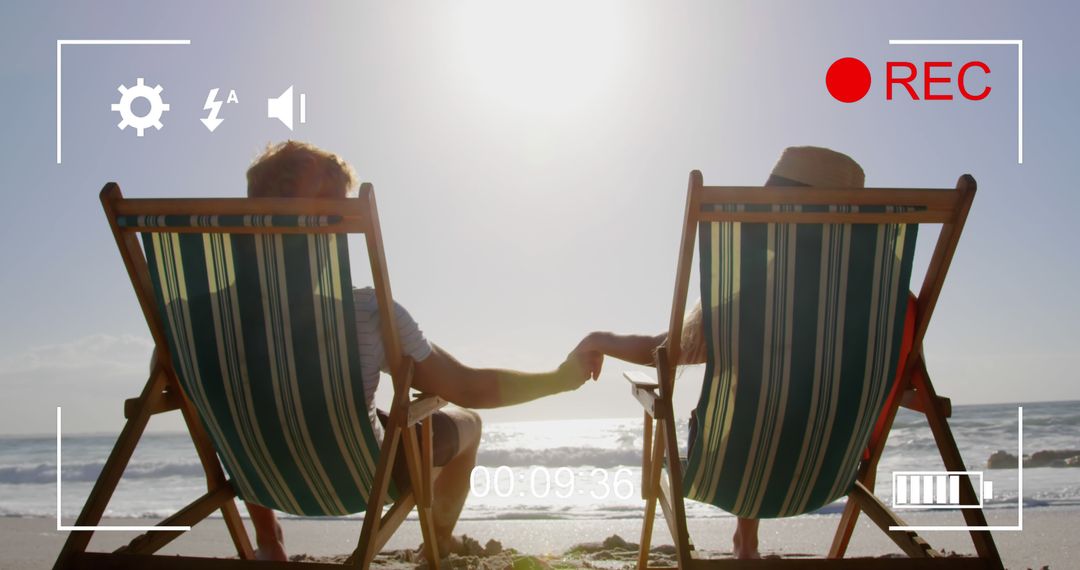 Couple Holding Hands on Beach Seen Through Recorded Video Viewfinder - Free Images, Stock Photos and Pictures on Pikwizard.com