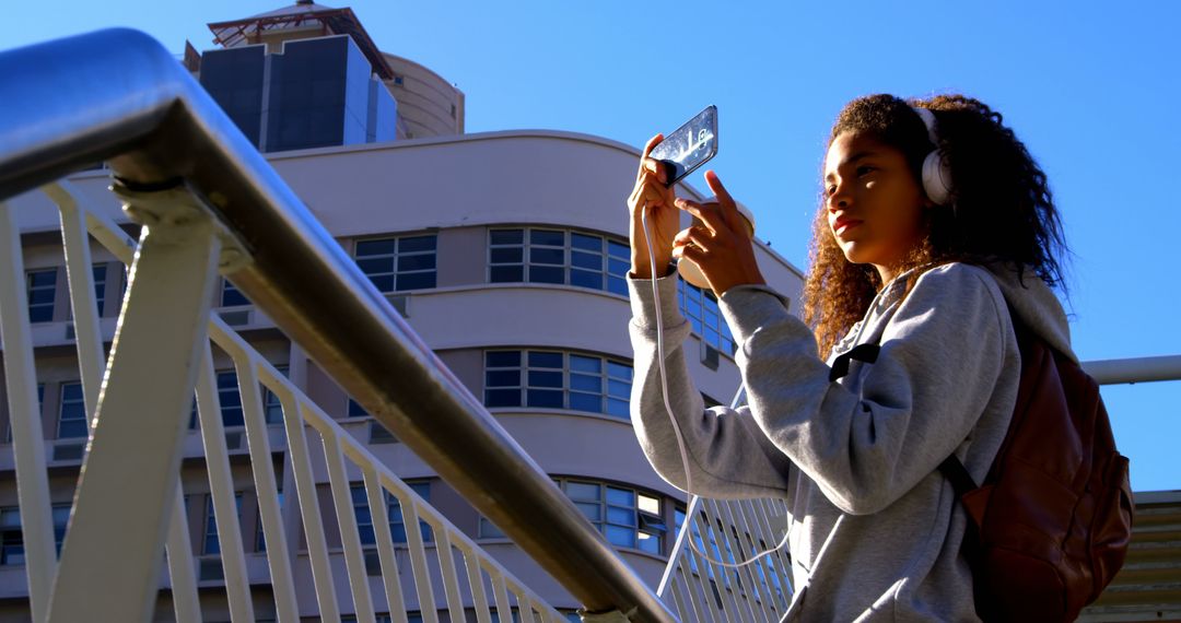 Young Woman Taking Photos with Smartphone Outdoors - Free Images, Stock Photos and Pictures on Pikwizard.com