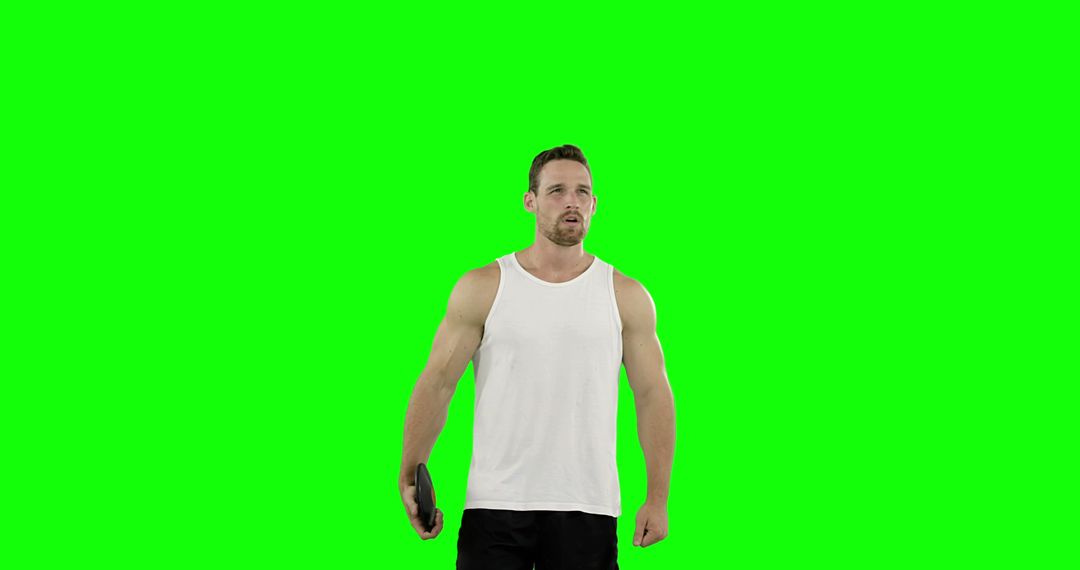 Muscular Man Holding Tablet with Green Screen Background - Free Images, Stock Photos and Pictures on Pikwizard.com