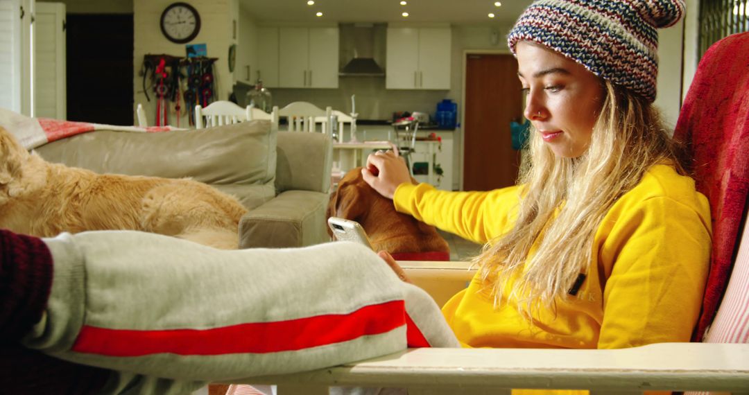 Young Woman Relaxing with Smartphone and Pets at Home - Free Images, Stock Photos and Pictures on Pikwizard.com