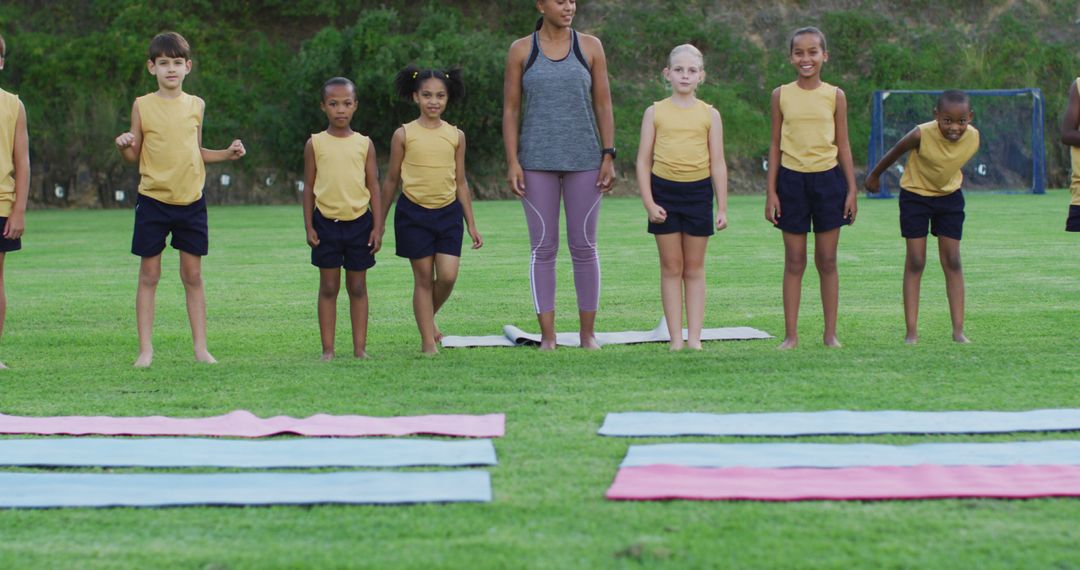 Children Practicing Yoga Outdoors with Instructor on Mats - Free Images, Stock Photos and Pictures on Pikwizard.com