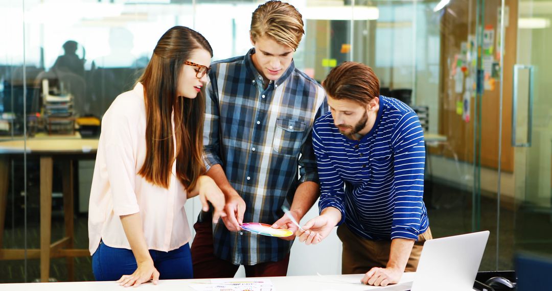 Creative Team Collaborating on Design Work in Modern Office