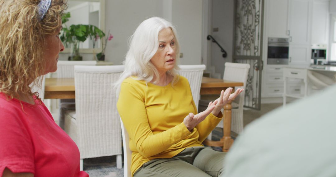 Mature Woman Sharing Thoughts During Group Therapy Session In Modern Living Room - Free Images, Stock Photos and Pictures on Pikwizard.com