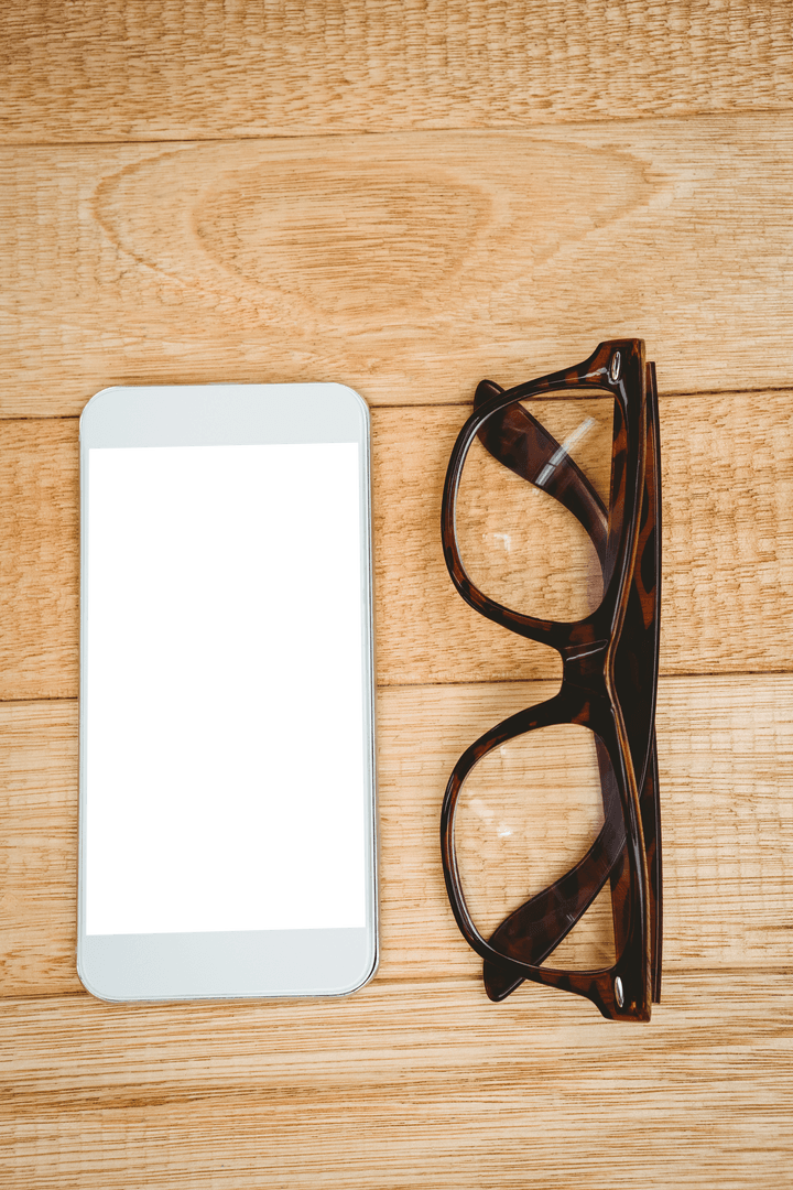 Transparent Smartphone Screen and Glasses on Wooden Desk