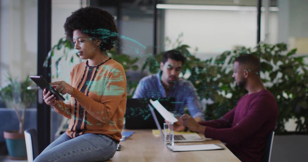 Professional Team Collaborating and Using Technology in Modern Office