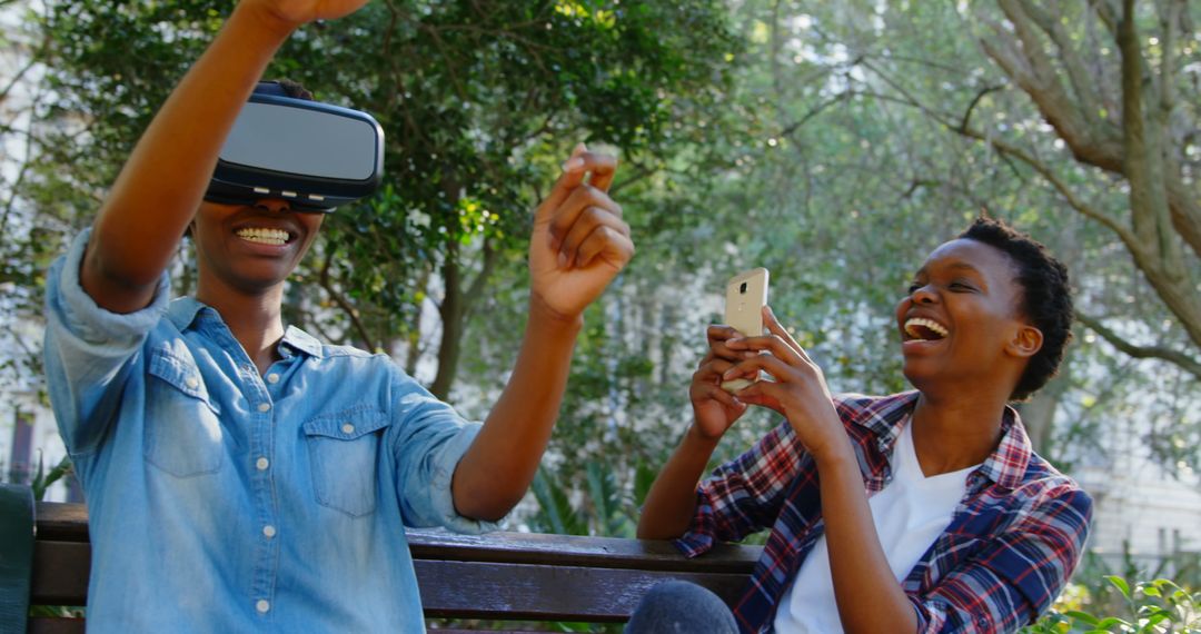 Twin Sisters Enjoying Virtual Reality in Park