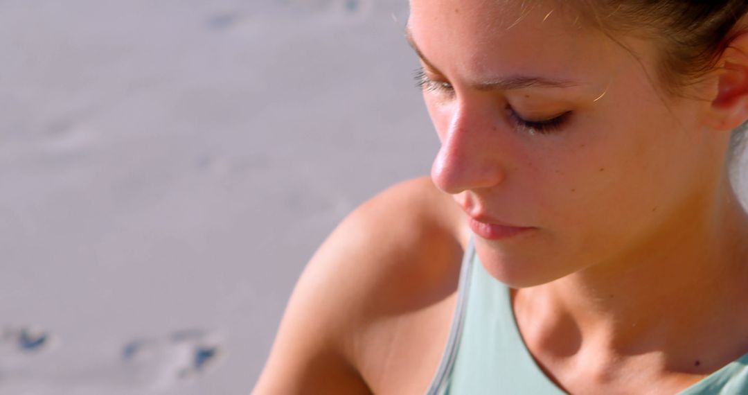 Serene Young Woman Meditating on Beach - Free Images, Stock Photos and Pictures on Pikwizard.com