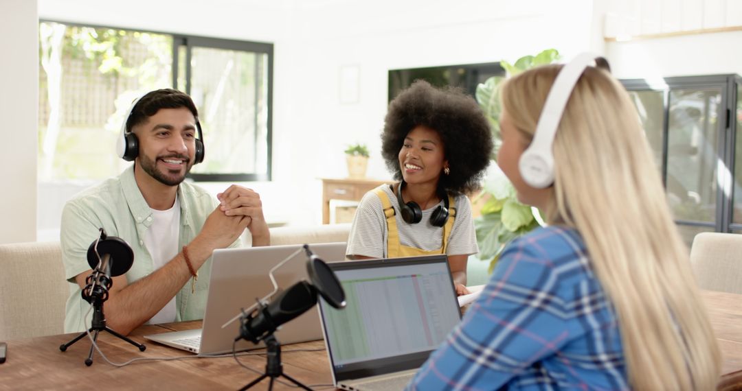 Creative Team Recording Podcast with Laptops and Microphones