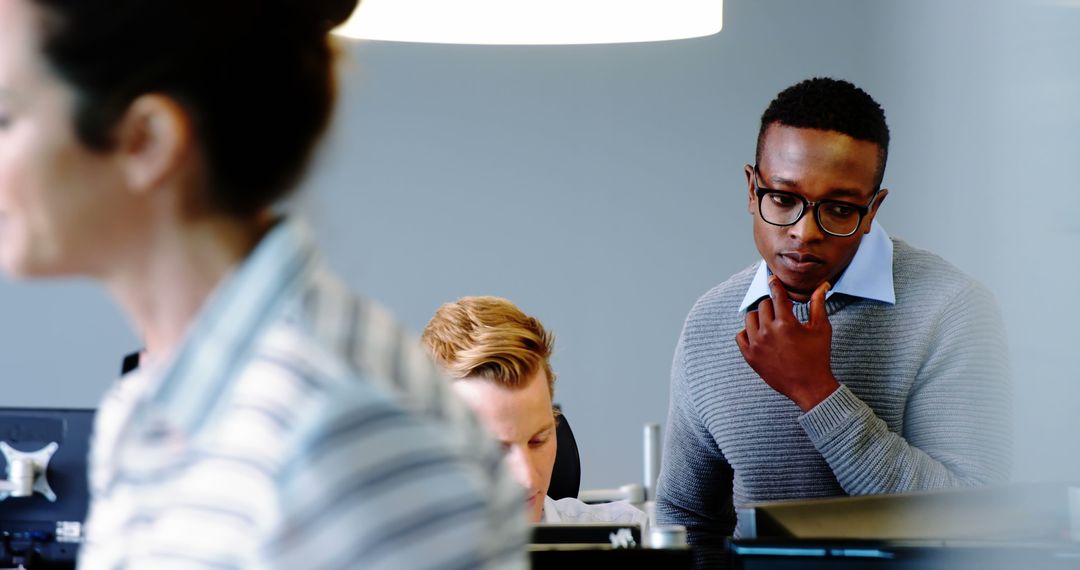 Focused Diverse Team Collaborating in Modern Office Space