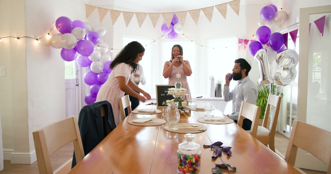 Family Setting Up Delightful Birthday Party with Decorations