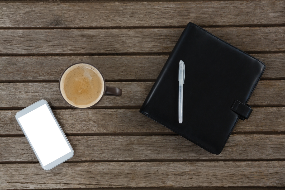 Transparent Overhead View of Coffee, Smartphone, Pen, and Planner on Wooden Table - Download Free Stock Images Pikwizard.com