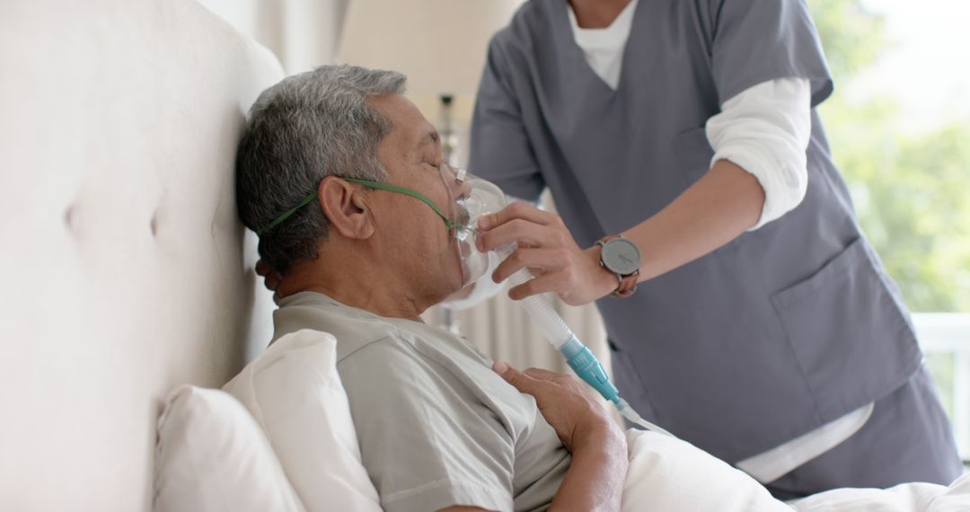 Nurse Providing Oxygen to Senior Male Patient in Hospital - Free Images, Stock Photos and Pictures on Pikwizard.com