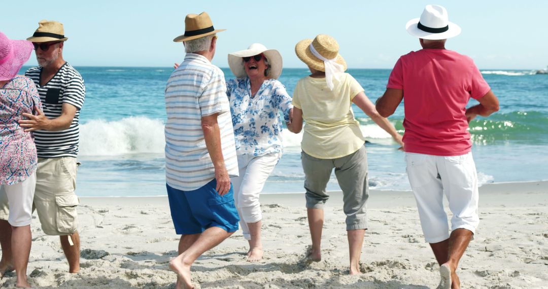 Senior Friends Dancing and Enjoying on Beach Vacation - Free Images, Stock Photos and Pictures on Pikwizard.com