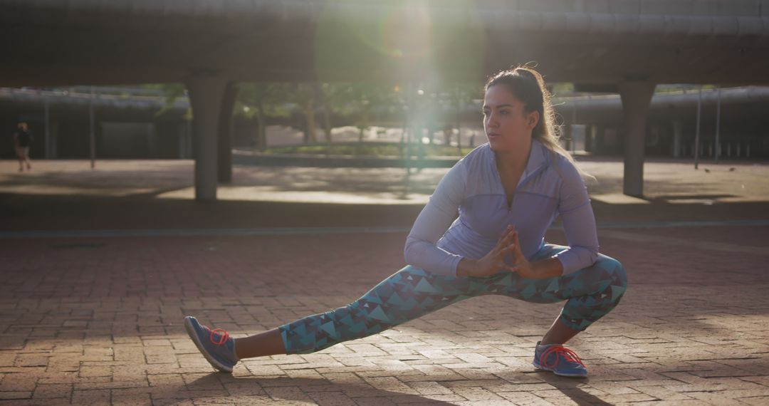 Woman Stretching Outdoors at Sunrise - Free Images, Stock Photos and Pictures on Pikwizard.com