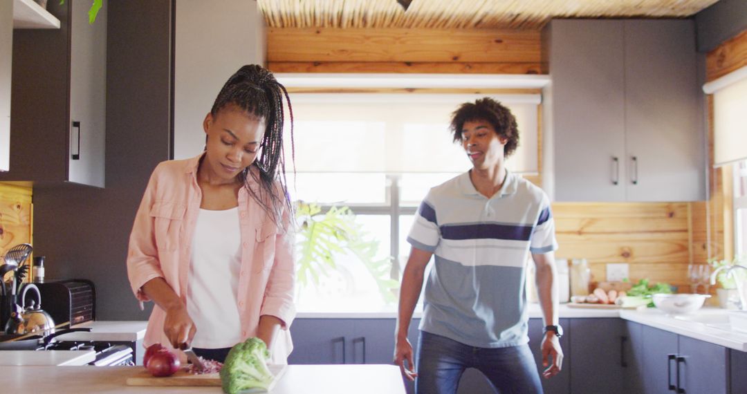 Happy Couple Dancing in Rustic Kitchen with Natural Light