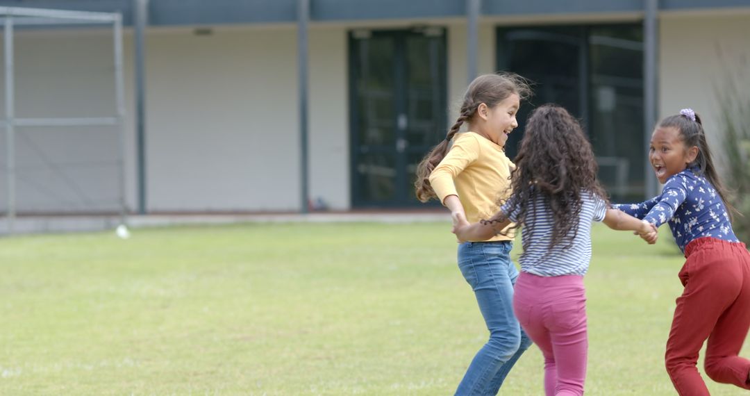 Biracial Girls Joyfully Playing on School Playground