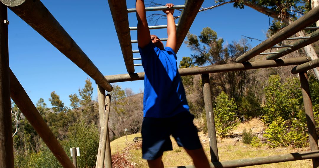 Man Traversing Monkey Bars in Outdoor Training Course - Free Images, Stock Photos and Pictures on Pikwizard.com