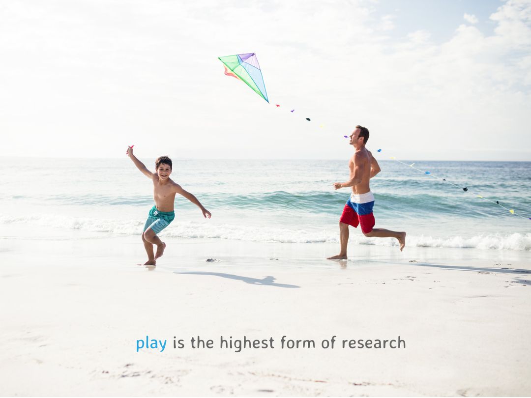 Father and Child Flying Kite on Sunny Beach