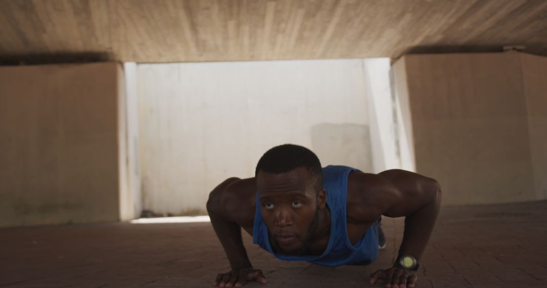 Fit Young Man Doing Push-Ups Under Bridge - Free Images, Stock Photos and Pictures on Pikwizard.com