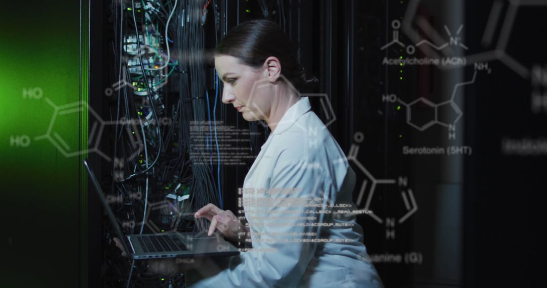 Female IT Technician Managing Server with Laptop in Data Center