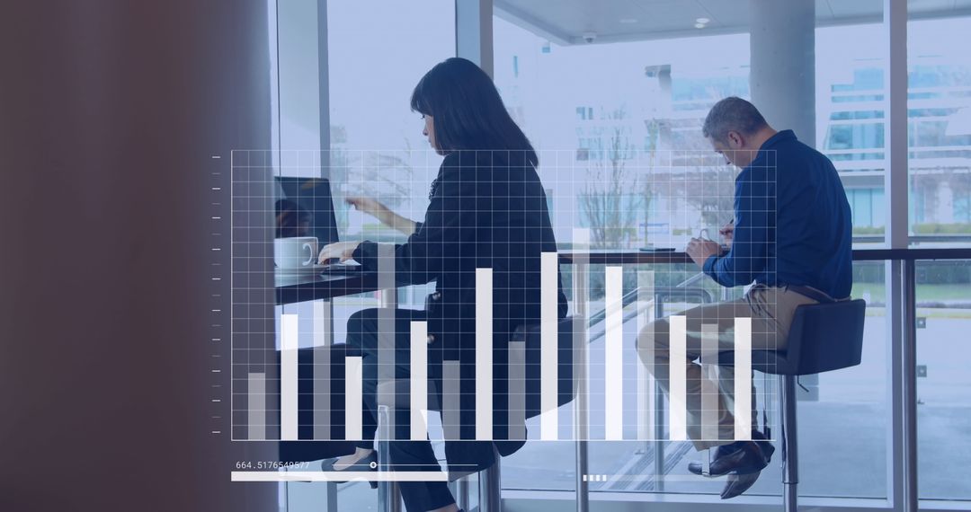 Diverse Business People Analyzing Data with Digital Graphics