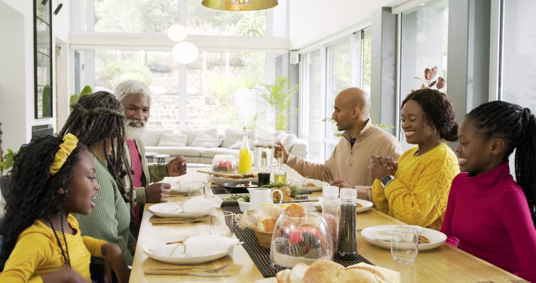 Multigenerational Family Gathering Sharing Meal Around Sunlit Open-Plan Dining Table
