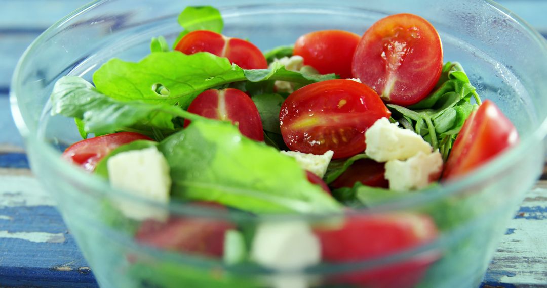 Fresh Vegetable Salad with Cherry Tomatoes and Feta Cheese in Glass Bowl - Free Images, Stock Photos and Pictures on Pikwizard.com