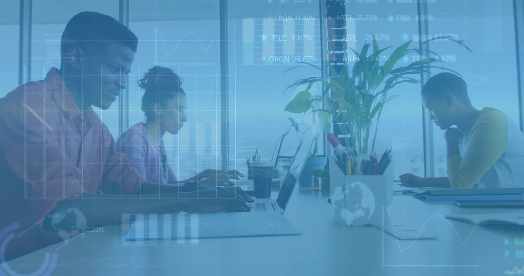 Digital Business Team Analyzing Data on Laptops in Modern Office