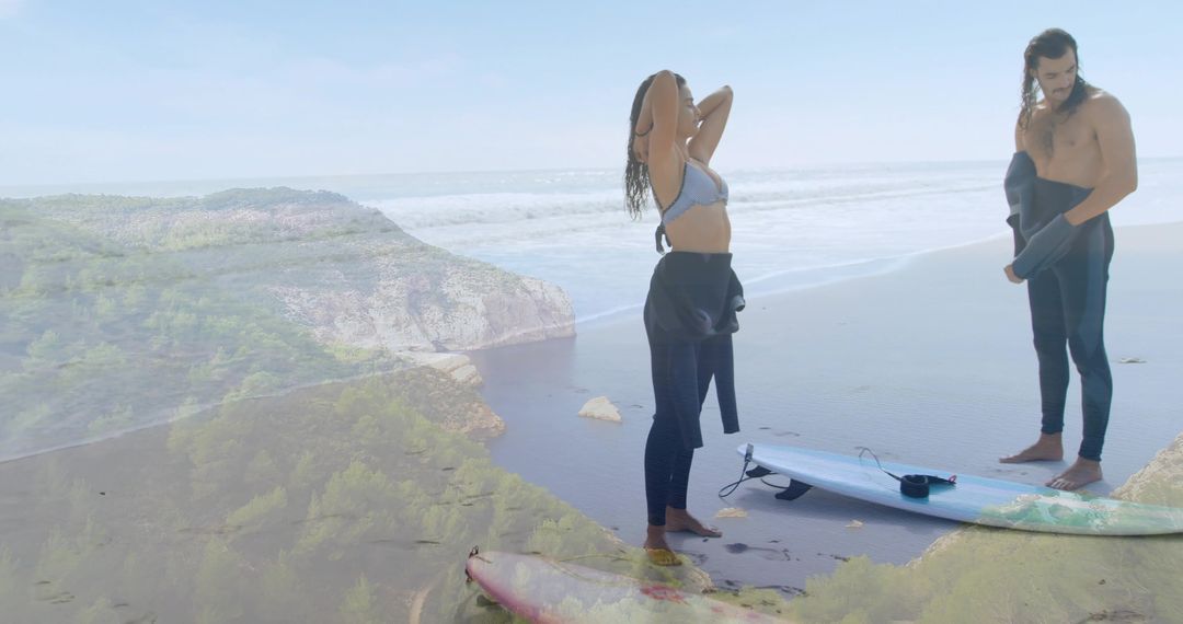 Surf Couple Preparing for Morning Session on Scenic Coastal Beach with Boards