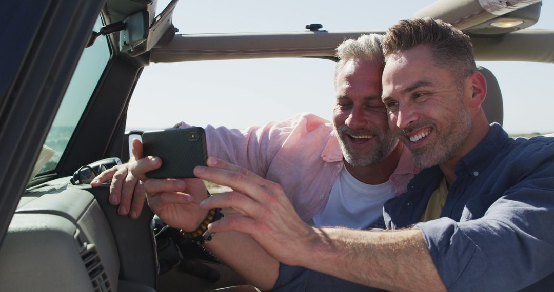 Joyful Couple Taking Selfie On Scenic Beach Adventure