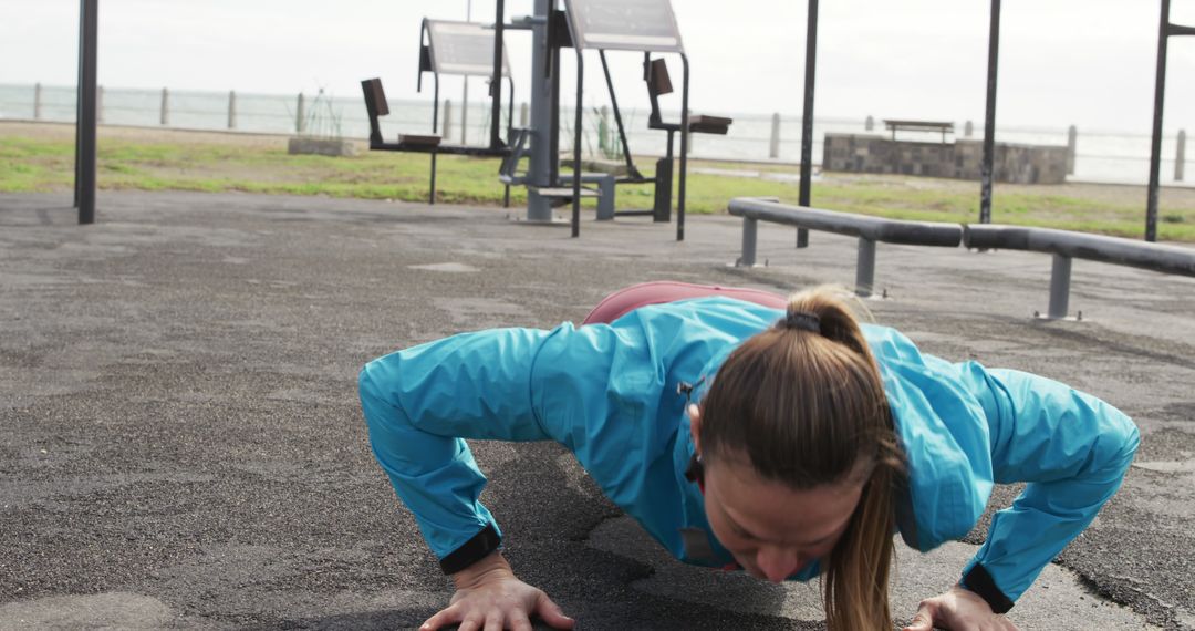 Female Athlete Doing Push-Ups at Outdoor Gym by the Beach - Free Images, Stock Photos and Pictures on Pikwizard.com