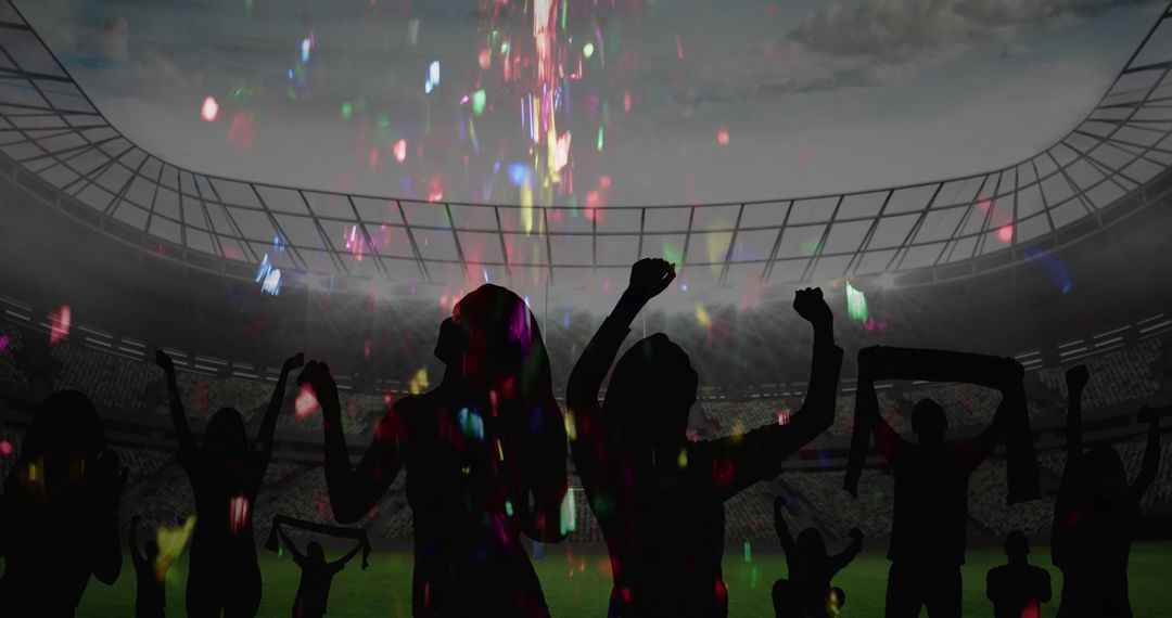 Silhouetted Fans Cheering in Stadium with Colorful Confetti Fall