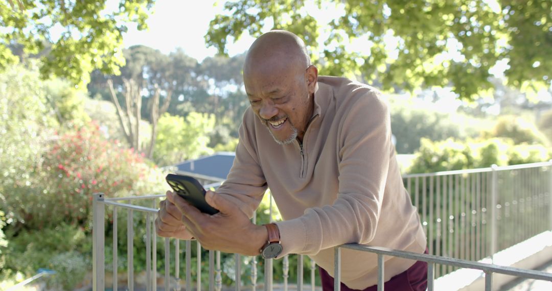 Happy Elderly Man Enjoying Smartphone Outdoors - Free Images, Stock Photos and Pictures on Pikwizard.com