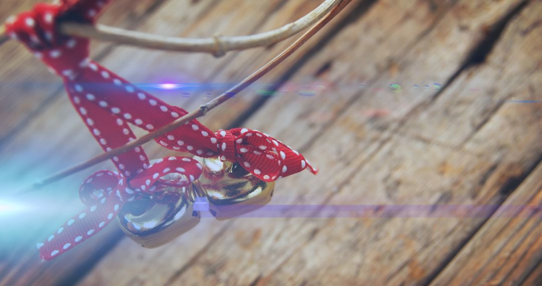 Festive Red Bow Bells with Rustic Wooden Background