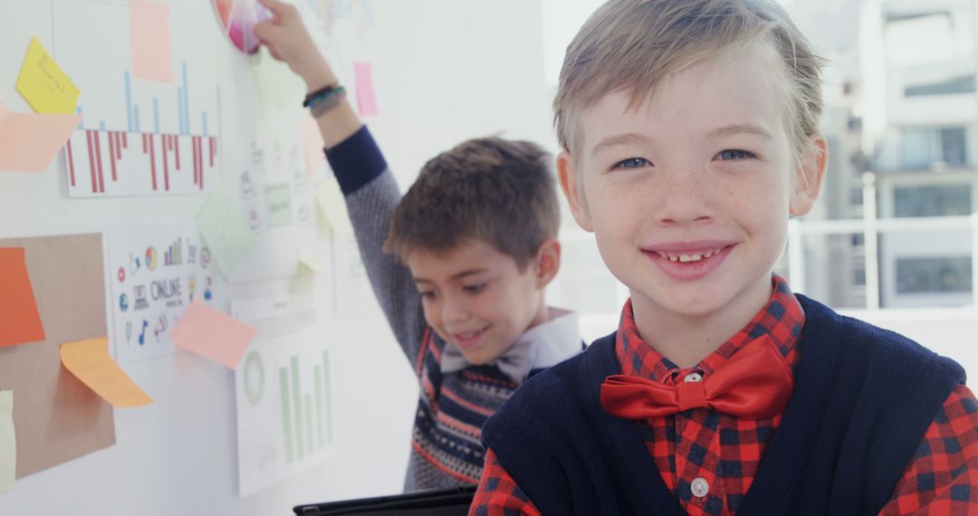 Smiling Boys in Classroom with Charts and Graphs - Free Images, Stock Photos and Pictures on Pikwizard.com