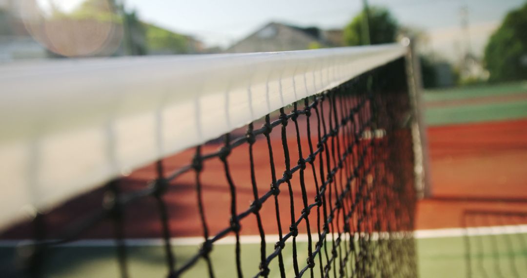 Up-Close View of Tennis Net Under Sunlight - Free Images, Stock Photos and Pictures on Pikwizard.com
