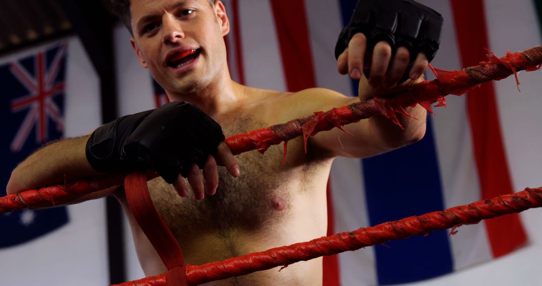 Confident Male Boxer in Boxing Ring with International Flags Background - Free Images, Stock Photos and Pictures on Pikwizard.com