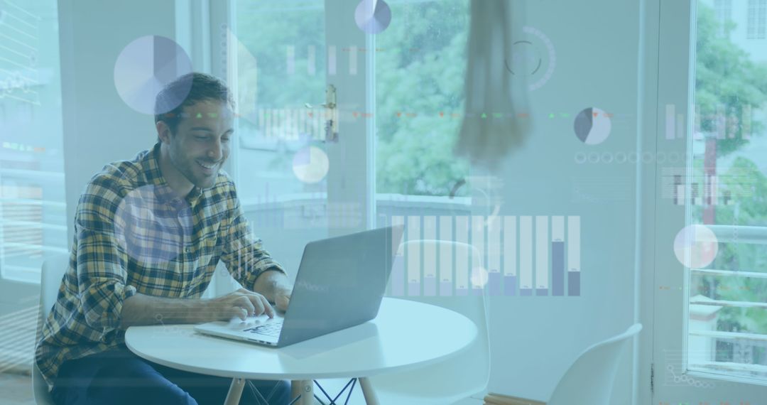 Smiling Businessman Using Laptop in Contemporary Office
