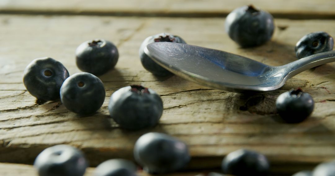 Fresh Blueberries with Spoon on Rustic Wooden Table - Free Images, Stock Photos and Pictures on Pikwizard.com