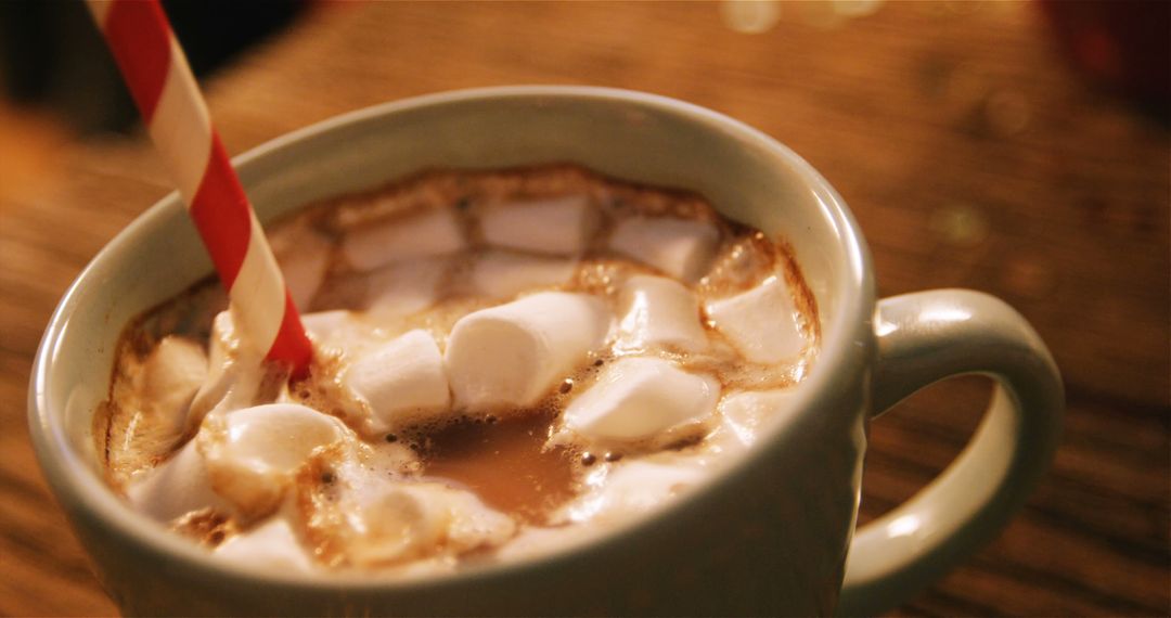 Cup of Hot Chocolate with Marshmallows and Red Striped Straw - Free Images, Stock Photos and Pictures on Pikwizard.com