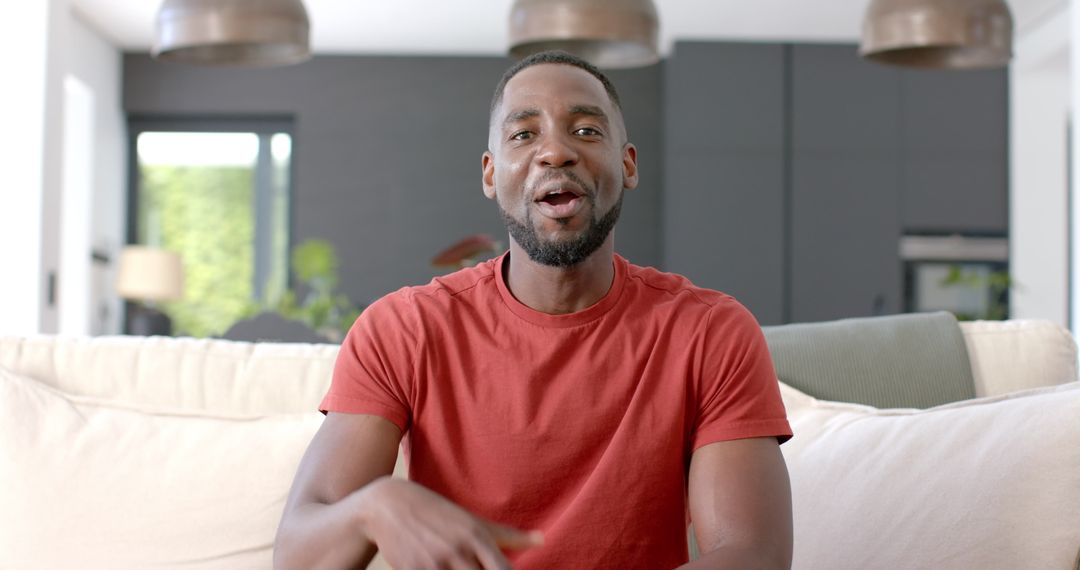African American Man Relaxing and Smiling on Couch